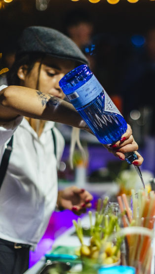 Lady mixing a Cocktail