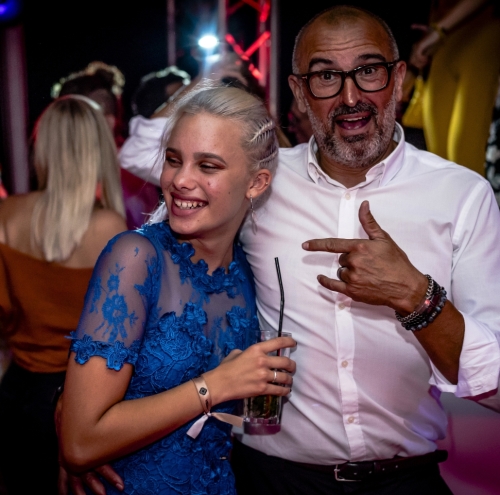 Couple enjoying themselves at a wedding