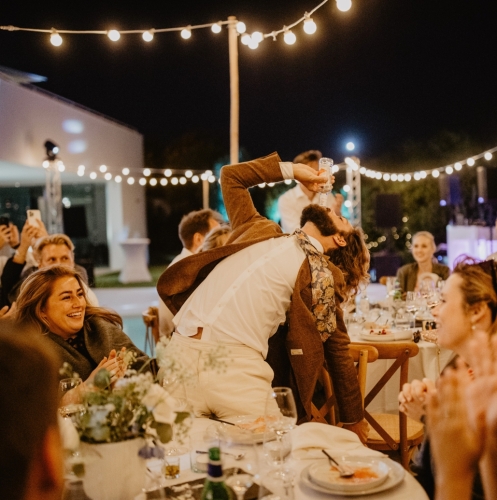 Downing a drink at a wedding